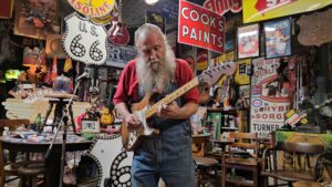Harley Russell of Erick Oklahoma playing guitar